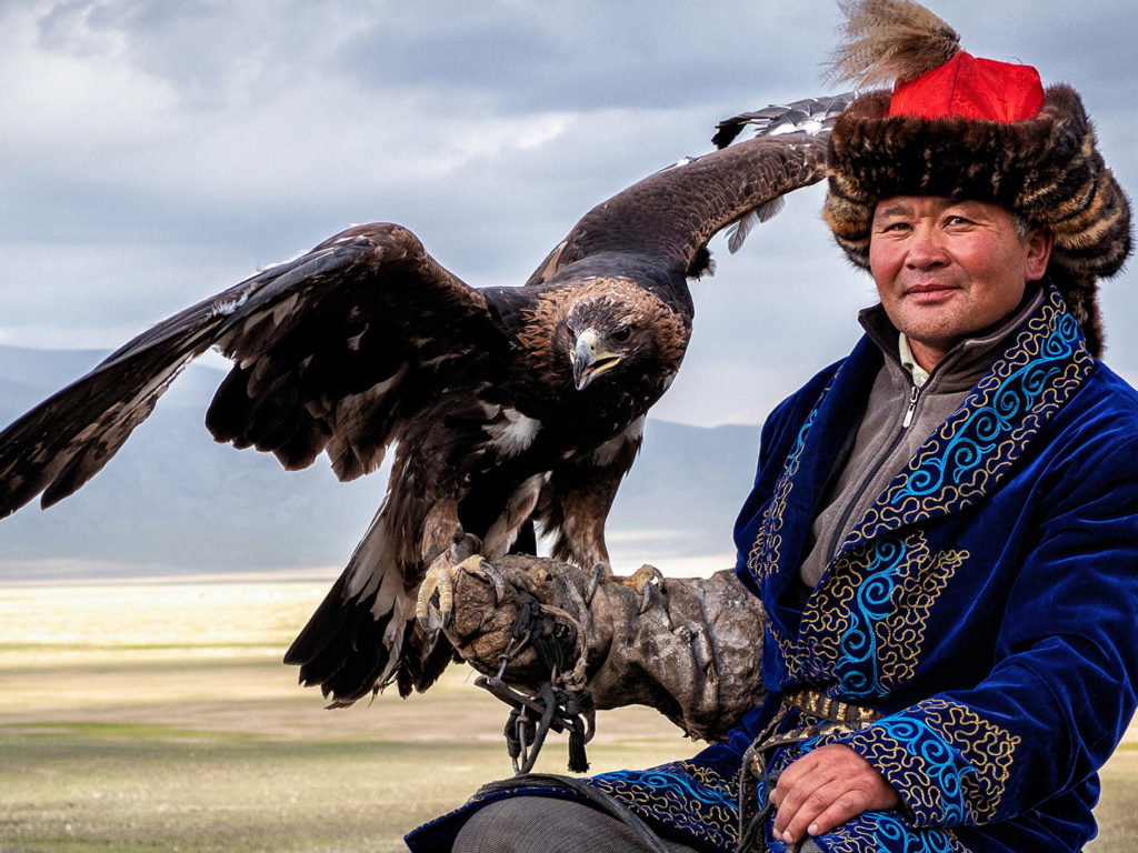 Eagle Hunter with his golden eagle in Bayan Olgii, West Mongolia